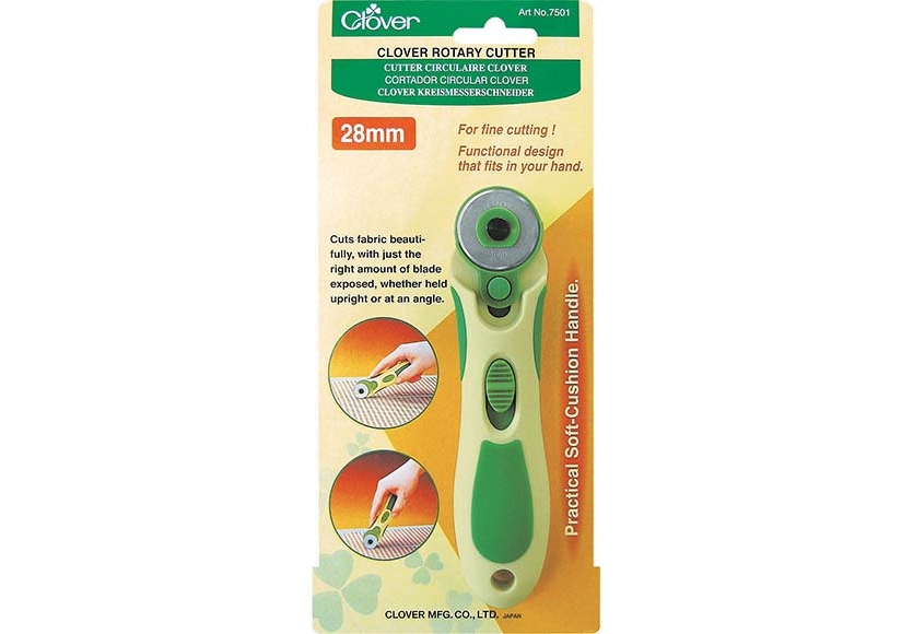 Cutter rotatif CLOVER 28mm avec manche ergonomique, lame exposée, pour découpe précise de tissu et patchwork.