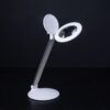 Lampe loupe rechargeable Daylight Halo Go 2, pliée et déployée, en utilisation pour travaux de précision.